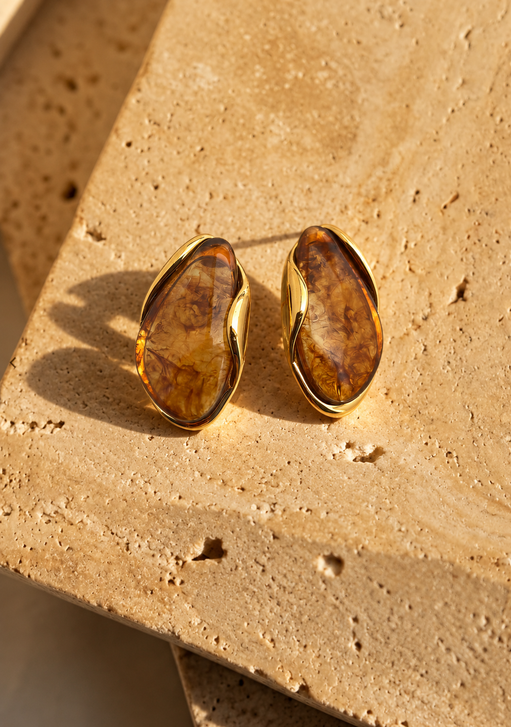 Pebble honey amber resin stud earrings with gold tone edge by Salt & Tide Co