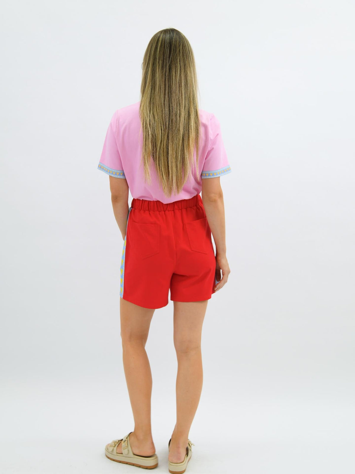 Heart Throb Shorts in Red, detail of the sky blue side stripe with yellow heart print, image 3