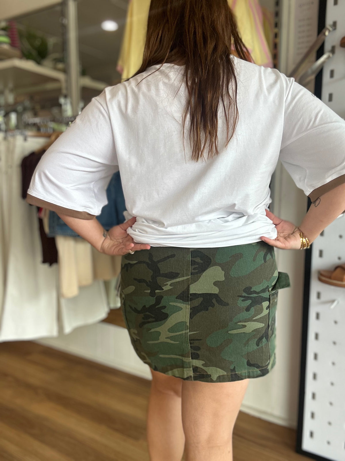 Dark camo print and Raisin' Hell patch detail on the By Frankie cargo skirt