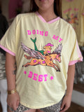 Doing My Best oversized graphic tee in lemon yellow with a pink V neckline and pink sleeve stripes