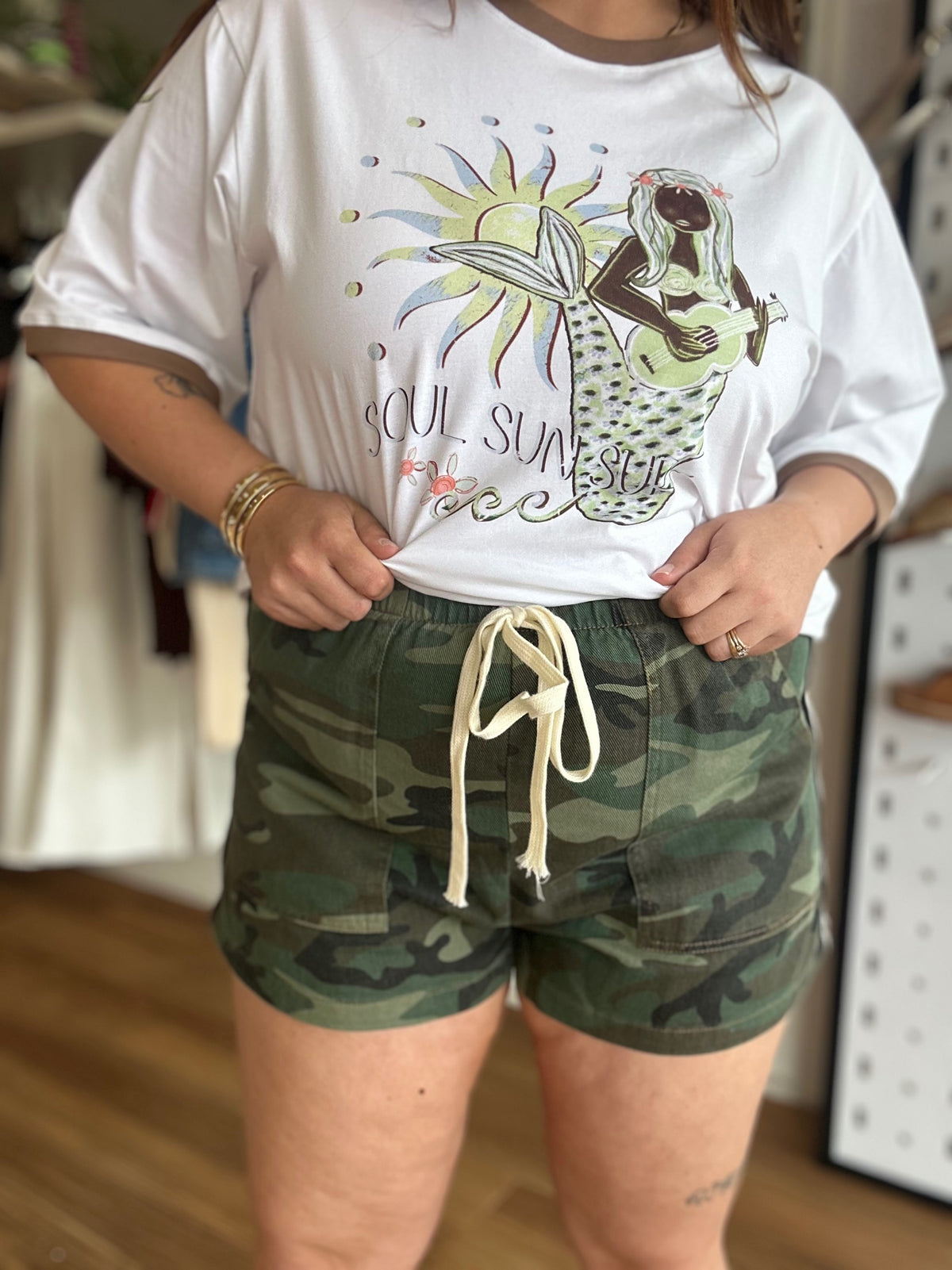 Dark camo print and racing stripe detail on the By Frankie Renegade shorts