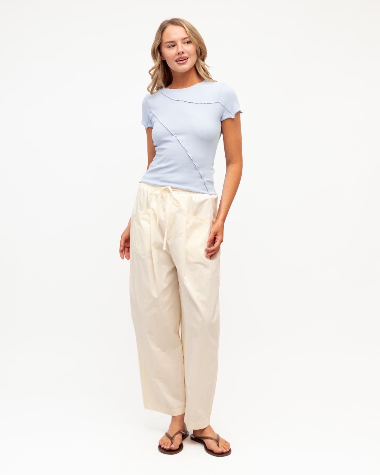 Sita Tee in blue - side view showing fitted silhouette