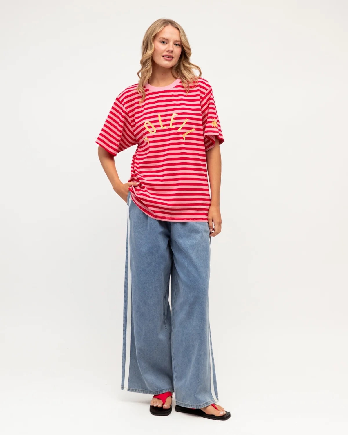 Soleil Graphic Tee, close-up of sunburst sleeve detail and contrast pink neckline