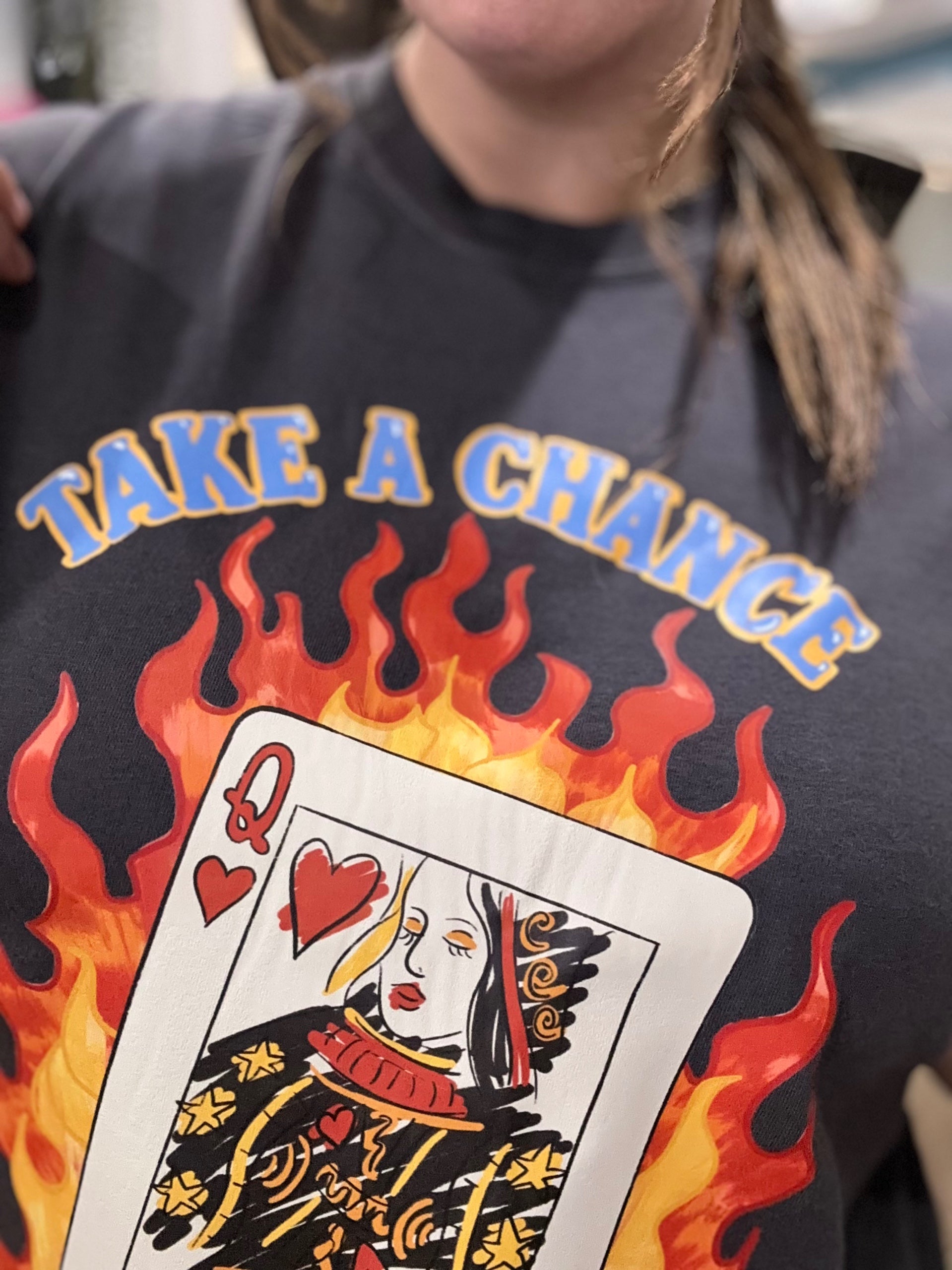 Close-up of the Lady Luck Queen of Hearts graphic print on the Salt & Tide Co charcoal cotton tee
