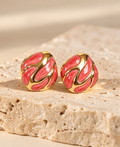 Swirl retro gold stud earrings with coral enamel swirl by Salt & Tide Co