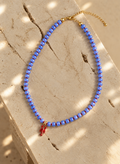 Seaside periwinkle glass bead necklace with red enamel lobster charm by Salt & Tide Co