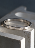 Constellation slim silver stainless steel bangle with ten sparkling stones by Salt & Tide Co