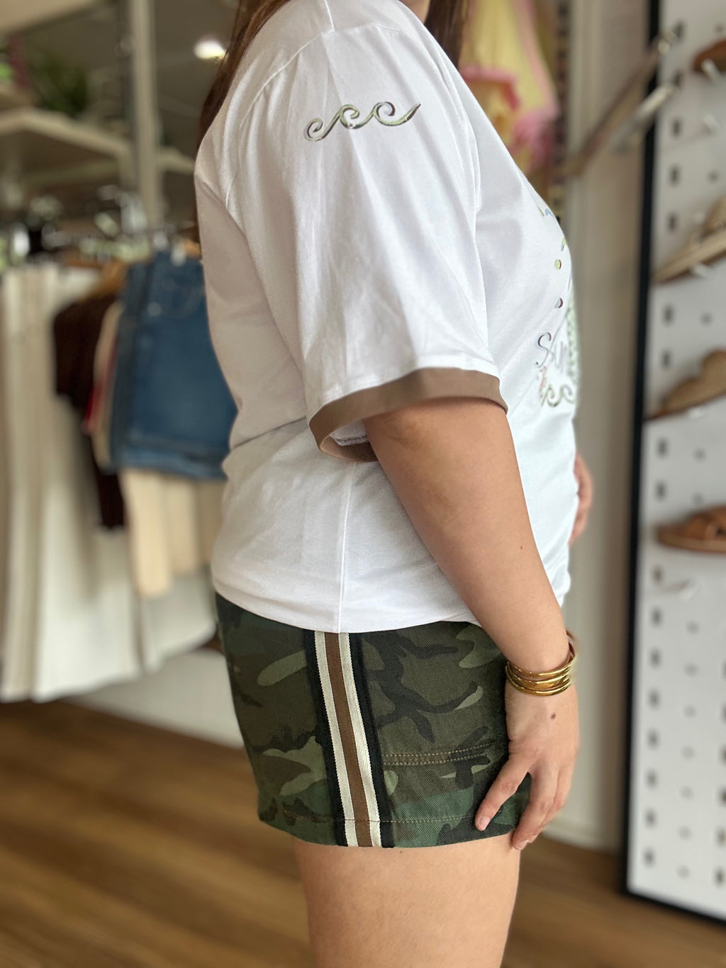By Frankie Renegade Camo Stripe Shorts in dark camo print with a contrast racing stripe and drawstring waist
