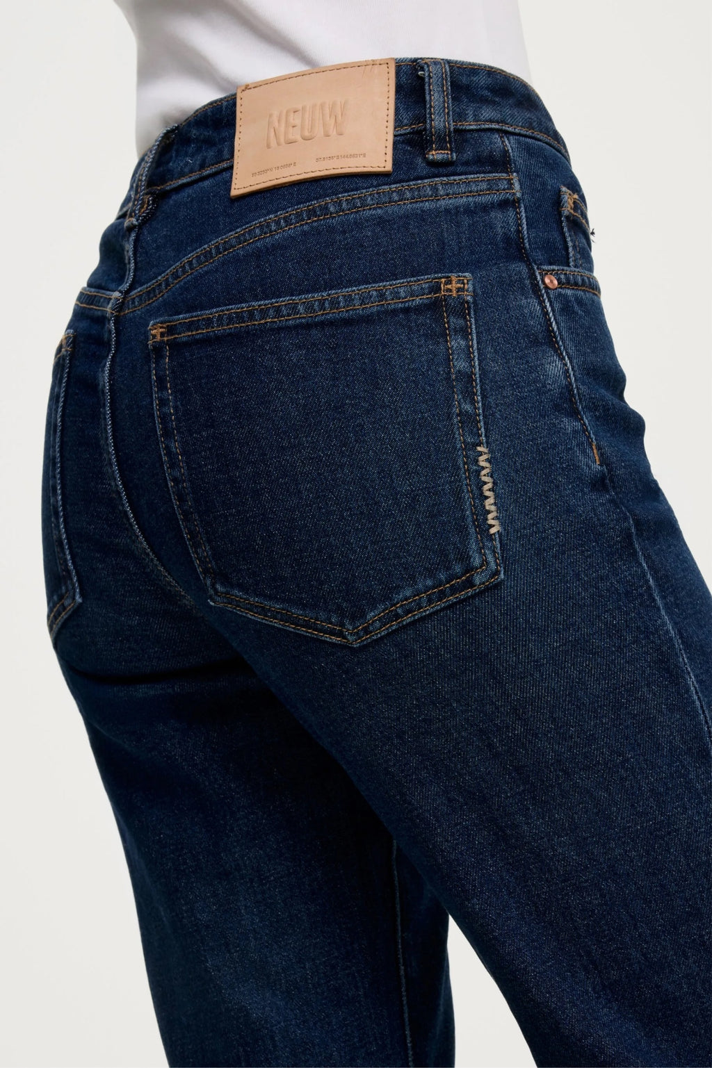 NEUW Freja Straight Jean in Brooding with antique silver shank button, rivets and signature repair stitch