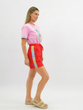 Heart Throb Shorts in Red, cherry red cotton shorts with sky blue side stripe and yellow hearts, image 1