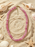 Sandbar blush necklace in mixed pink glass beads with gold tone clasp by Salt & Tide Co