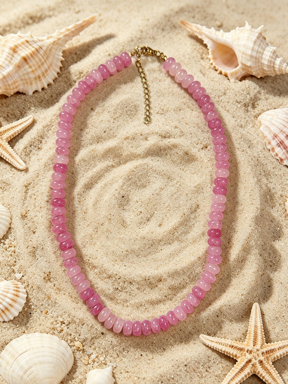 Sandbar blush necklace in mixed pink glass beads with gold tone clasp by Salt & Tide Co